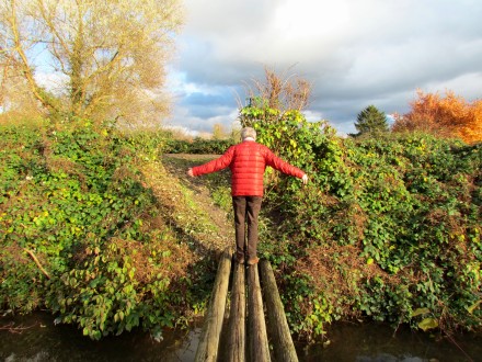 My dad balancing across a bridge