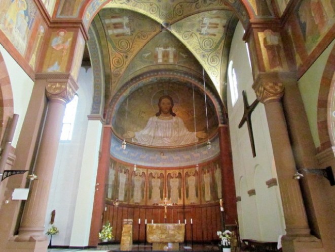 Painting of Christ Pantocrator in the apse, reminiscent of Byzantine mosaics.